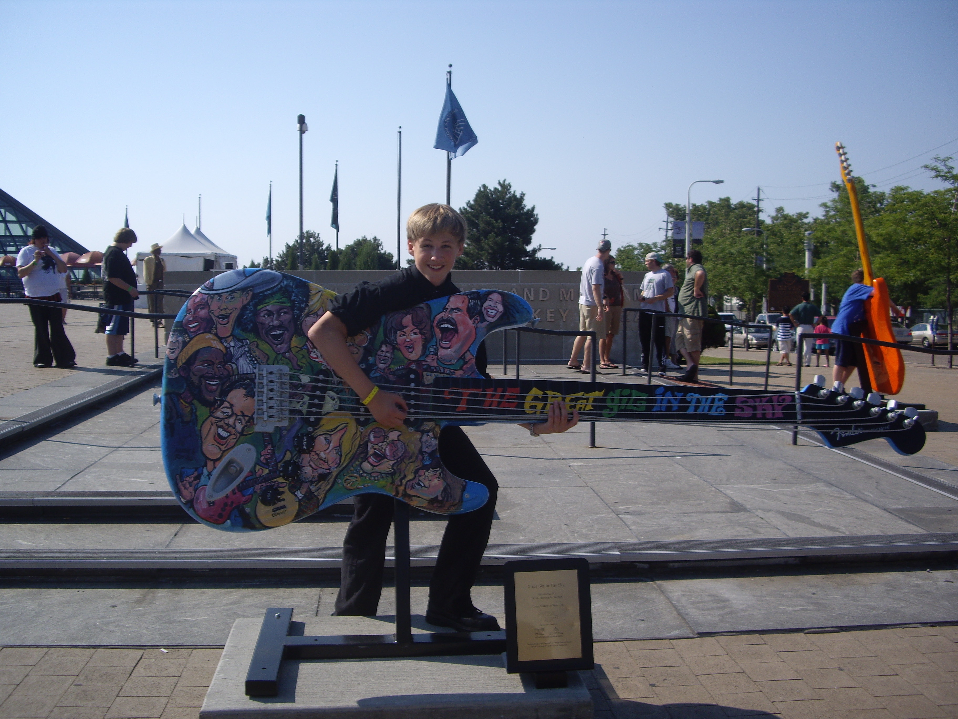 David playing an over-sized guitar (Rock and Roll Hall of Fame)
